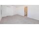 Large main bedroom with carpet flooring, closet and an ensuite bathroom at 18059 Regan Ave, Port Charlotte, FL 33948