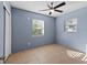 Bright bedroom with tiled flooring, ceiling fan, and two windows, offering great natural light at 1023 Madison St, Largo, FL 33770