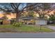 Charming single-story home featuring a well-maintained front yard and attached garage at 1023 Madison St, Largo, FL 33770