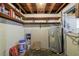 Unfinished basement with water heater and building materials at 1023 Madison St, Largo, FL 33770