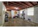 Unfinished basement area with various storage items and tools at 1023 Madison St, Largo, FL 33770