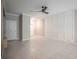 Spacious living room with tile floors and wainscoting at 2136 Cerulean Sky Way, Lutz, FL 33558