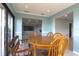 Dining area featuring a wooden table and views into an adjacent living space at 517 20Th Ave, Indian Rocks Beach, FL 33785