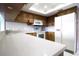 A bright kitchen featuring a stove, microwave, and refrigerator at 517 20Th Ave, Indian Rocks Beach, FL 33785