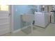 Laundry room with a utility sink, and a modern washing machine and dryer at 517 20Th Ave, Indian Rocks Beach, FL 33785