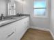 Bathroom with gray countertops and double sinks at 1340 Redstart Rd, Venice, FL 34293