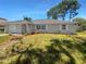 Ranch style home with a newly landscaped front yard at 1340 Redstart Rd, Venice, FL 34293
