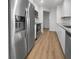 Modern kitchen with stainless steel appliances and white cabinets at 1340 Redstart Rd, Venice, FL 34293