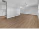 Open concept living room with hardwood floors and kitchen view at 1340 Redstart Rd, Venice, FL 34293