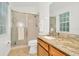 Bathroom with granite vanity, shower, and linen closet at 2111 Tetley Ct, Brandon, FL 33510