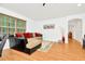 Spacious living room featuring a comfortable sectional sofa and wood floors at 2111 Tetley Ct, Brandon, FL 33510