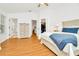 Main bedroom with large bed, dresser, and walk-in closet at 2111 Tetley Ct, Brandon, FL 33510