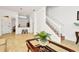 Living room with view of kitchen, stairs and entryway at 2111 Tetley Ct, Brandon, FL 33510