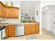 Modern kitchen with wood cabinets, granite counters, and stainless steel appliances at 2111 Tetley Ct, Brandon, FL 33510