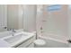 Bathroom featuring neutral tiling, shower and tub, and large vanity at 4990 Fairhope Cir, Lakewood Ranch, FL 34211