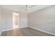 Bedroom with hardwood flooring and modern ceiling fan at 4990 Fairhope Cir, Lakewood Ranch, FL 34211