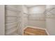 Walk-in closet features wire shelving and laminate wood floor at 4990 Fairhope Cir, Lakewood Ranch, FL 34211