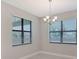 Dining Area with modern chandelier and natural lighting at 4990 Fairhope Cir, Lakewood Ranch, FL 34211