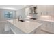 Bright kitchen offers a large island, stainless steel vent hood, and plentiful cabinet space at 4990 Fairhope Cir, Lakewood Ranch, FL 34211