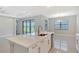 The kitchen features a large island with seating and stainless steel appliances at 4990 Fairhope Cir, Lakewood Ranch, FL 34211