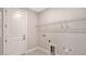 Laundry Room featuring neutral coloring, door to exterior, and wire shelving at 4990 Fairhope Cir, Lakewood Ranch, FL 34211