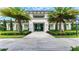 Community clubhouse entrance with landscaping and paved walkway at 4990 Fairhope Cir, Lakewood Ranch, FL 34211