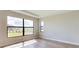 Bright bedroom with large window and light neutral walls at 4845 Carova Way, Lakewood Ranch, FL 34211