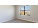 Simple bedroom with large window and neutral wall color at 4845 Carova Way, Lakewood Ranch, FL 34211