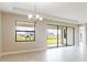 Bright dining room with sliding doors to backyard at 4845 Carova Way, Lakewood Ranch, FL 34211