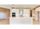 Bright kitchen boasts a large island, white cabinets, and stainless steel appliances at 4845 Carova Way, Lakewood Ranch, FL 34211