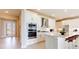 Modern white kitchen with stainless steel appliances and a bright, open design at 4845 Carova Way, Lakewood Ranch, FL 34211