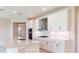 Modern kitchen featuring white cabinets, stainless steel appliances, and quartz countertops at 4845 Carova Way, Lakewood Ranch, FL 34211