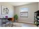 Home office with a desk, chair, and built-in shelving at 4845 Carova Way, Lakewood Ranch, FL 34211