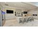 Modern clubhouse kitchen with marble countertops and bar seating at 4845 Carova Way, Lakewood Ranch, FL 34211