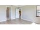Bedroom with access to bathroom and large window at 4845 Carova Way, Lakewood Ranch, FL 34211