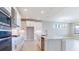 Spacious kitchen with white cabinets, quartz countertops, and stainless steel appliances at 4845 Carova Way, Lakewood Ranch, FL 34211