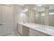 Spacious bathroom features double sinks, a large mirror, and a walk-in shower at 4910 Carova Way, Lakewood Ranch, FL 34211