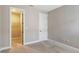 Bedroom with carpet and a closet with wire shelving, and a white door at 4910 Carova Way, Lakewood Ranch, FL 34211