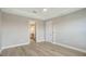 Open bedroom featuring smooth flooring and an open doorway to an en-suite bathroom at 4910 Carova Way, Lakewood Ranch, FL 34211