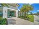 Community Clubhouse Entrance featuring glass doors, manicured landscaping and a paved walkway at 4910 Carova Way, Lakewood Ranch, FL 34211