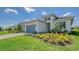 Contemporary single-story home with well-manicured landscaping, offering a welcoming exterior view at 4910 Carova Way, Lakewood Ranch, FL 34211