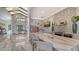 Modern kitchen featuring a marble island with bar seating and stainless steel appliances at 4910 Carova Way, Lakewood Ranch, FL 34211