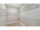 Spacious walk-in closet features ample storage with wire shelving and light wood floors at 4910 Carova Way, Lakewood Ranch, FL 34211
