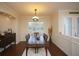 Formal dining room with hardwood floors and large windows at 7280 Verna Bethany Rd, Myakka City, FL 34251