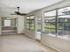 Sunroom with sliding glass doors and view of backyard at 716 Fox Hills Dr, Sun City Center, FL 33573