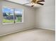 Bright bedroom with neutral carpeting and ceiling fan at 716 Fox Hills Dr, Sun City Center, FL 33573