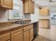 Kitchen boasts ample counter space and wood cabinets at 716 Fox Hills Dr, Sun City Center, FL 33573