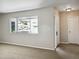 Entryway with neutral carpeting and large window at 716 Fox Hills Dr, Sun City Center, FL 33573