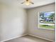 Bedroom with large window and ceiling fan at 716 Fox Hills Dr, Sun City Center, FL 33573