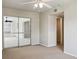 Bright bedroom with mirrored closet doors and ceiling fan at 716 Fox Hills Dr, Sun City Center, FL 33573